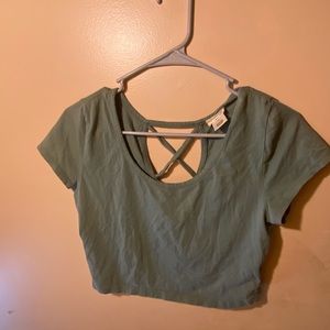 Green crop top with crisscross backing, is a XL but fits like a large